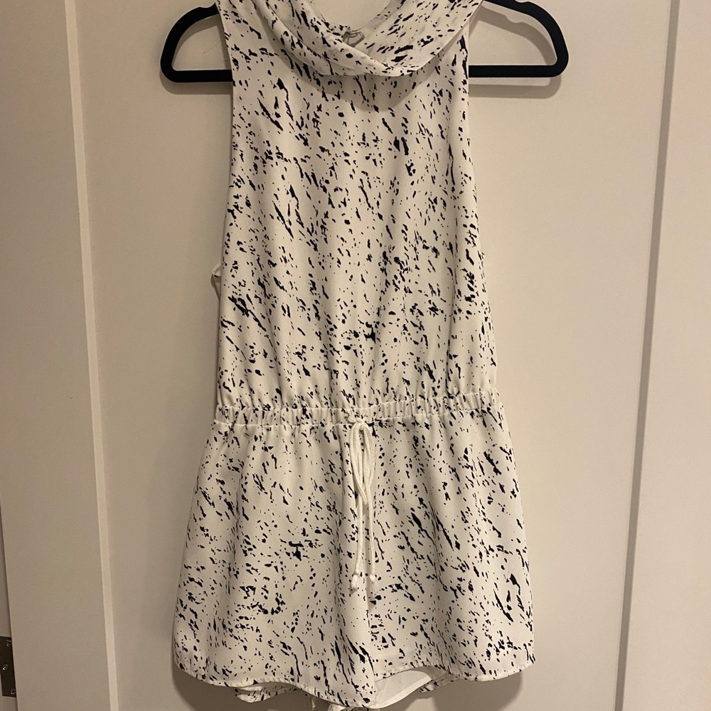 White, black speckled romper